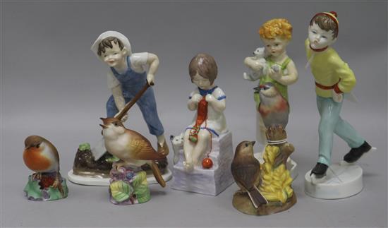 Four Royal Worcester Child figures and three models of songbirds,